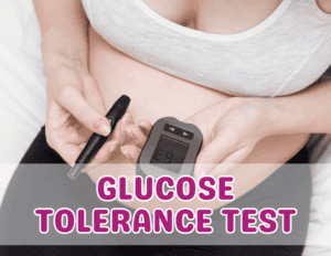 Pregnant woman holding a glucose monitor, tracking blood sugar levels during her glucose tolerance test.