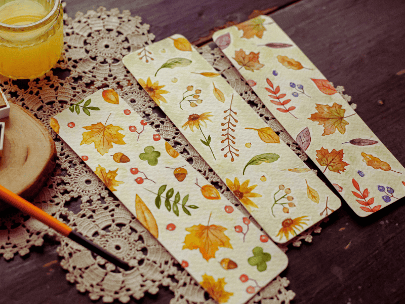 Pressed flower bookmark with delicate floral design, a beautiful and handmade baby shower favor idea for guests.