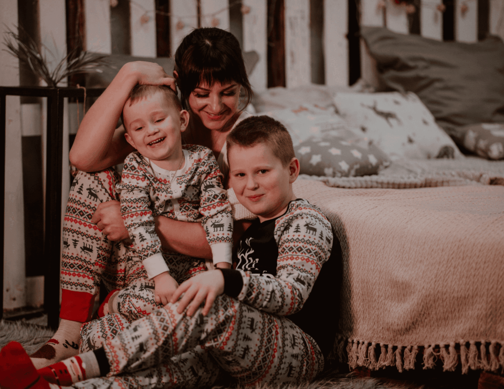 Family wearing matching Christmas pajamas as a great way to celebrate baby's first Christmas together.