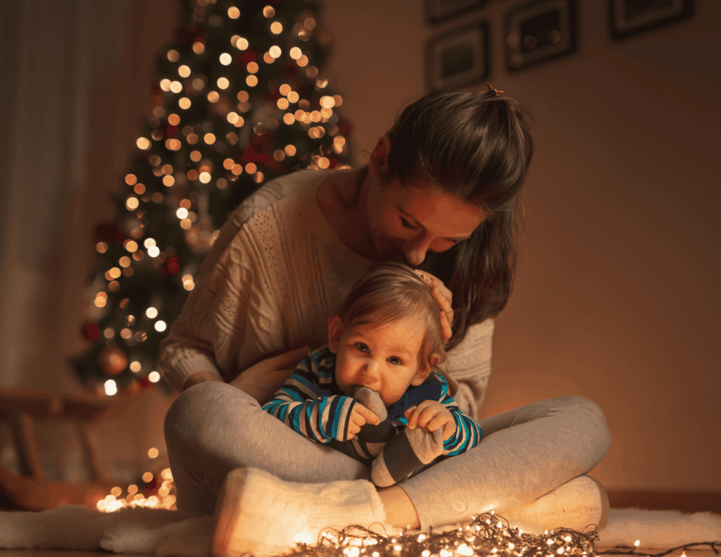 Mom and son creating traditions for baby's first Christmas.
